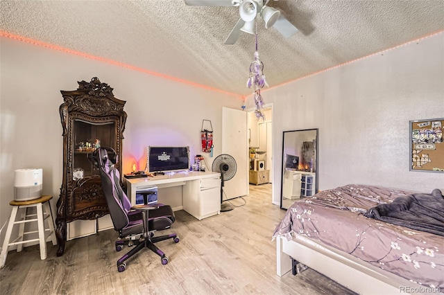11636 Community Center Dr Unit 29, Northglenn, CO 80233 - bedroom with a textured ceiling, light wood-type flooring, a desk, and a ceiling fan