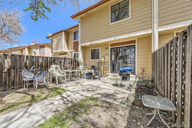11636 Community Center Dr Unit 29, Northglenn, CO 80233 - rear view of property featuring a fenced backyard and a patio