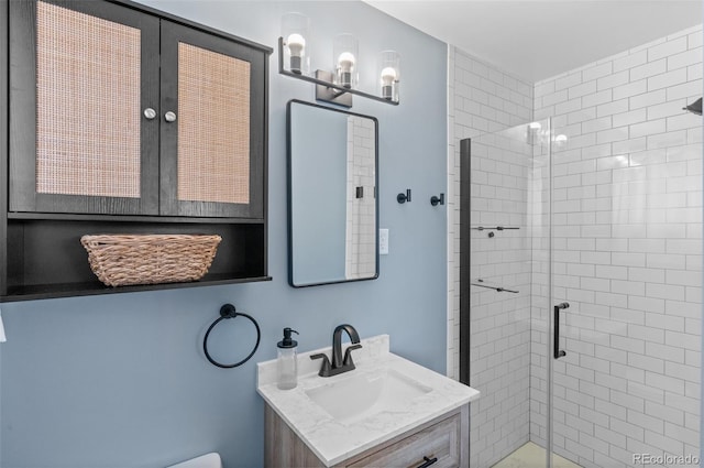 full bathroom featuring a stall shower and vanity