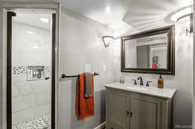 full bath with a stall shower and vanity