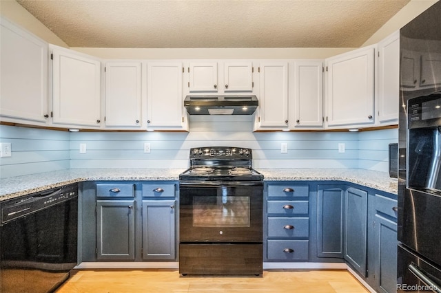 kitchen featuring a textured ceiling, white cabinetry, and black appliances