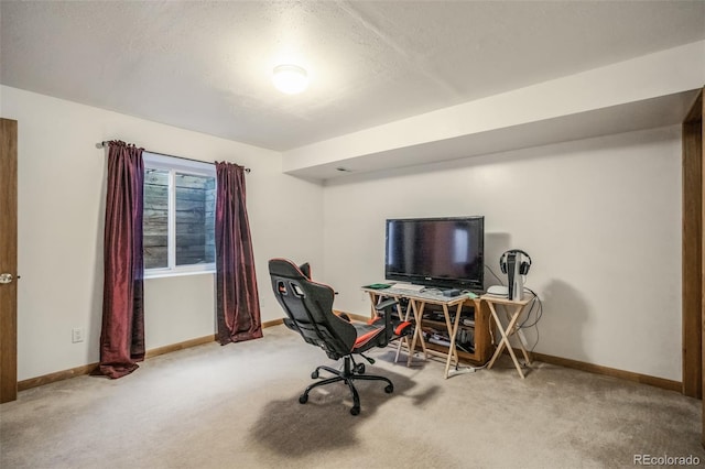 carpeted office space with a textured ceiling