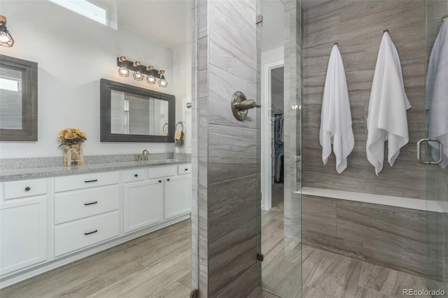 12513 Shore Point St, Firestone, CO 80504 - full bathroom featuring vanity and a tile shower