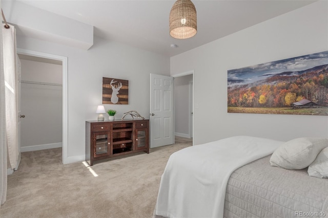 12513 Shore Point St, Firestone, CO 80504 - carpeted bedroom with a spacious closet and baseboards