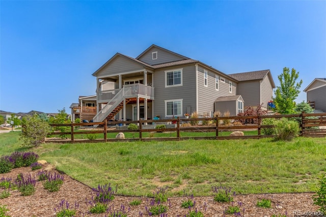 12513 Shore Point St, Firestone, CO 80504 - rear view of house with a fenced backyard and stairs