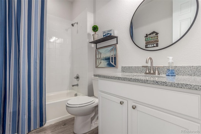 12513 Shore Point St, Firestone, CO 80504 - full bath with vanity, wood finished floors, shower / bath combo with shower curtain, and toilet