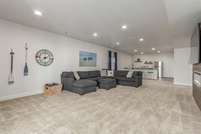 12513 Shore Point St, Firestone, CO 80504 - living area featuring light colored carpet, recessed lighting, and baseboards