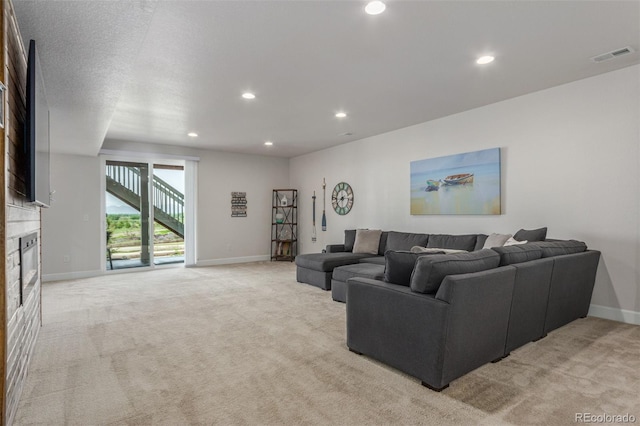 12513 Shore Point St, Firestone, CO 80504 - living area with light carpet, a fireplace, recessed lighting, and baseboards