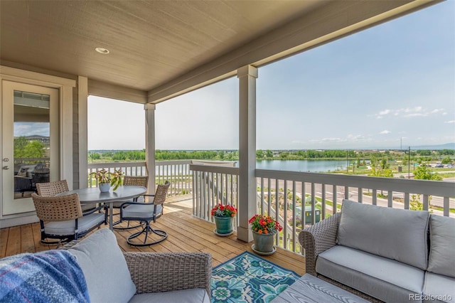 12513 Shore Point St, Firestone, CO 80504 - wooden deck with a water view and outdoor dining space