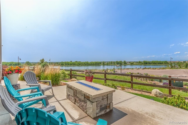 12513 Shore Point St, Firestone, CO 80504 - view of patio with a fire pit and a water view