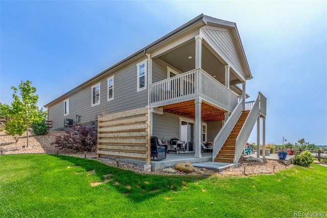 12513 Shore Point St, Firestone, CO 80504 - rear view of property featuring stairway, a patio, a yard, and a deck