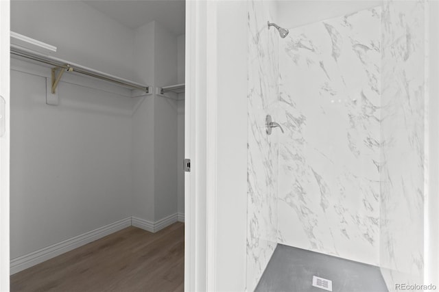 walk in closet featuring hardwood / wood-style flooring