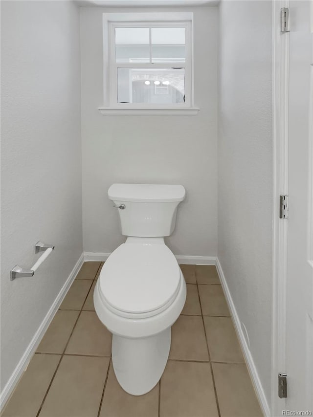 bathroom with tile patterned floors and toilet