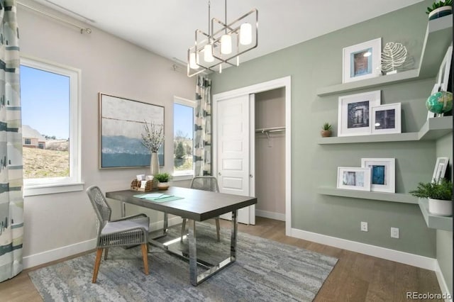 1736 Barefoot Dr, Windsor, CO 80550 - office space with plenty of natural light, wood finished floors, and a chandelier