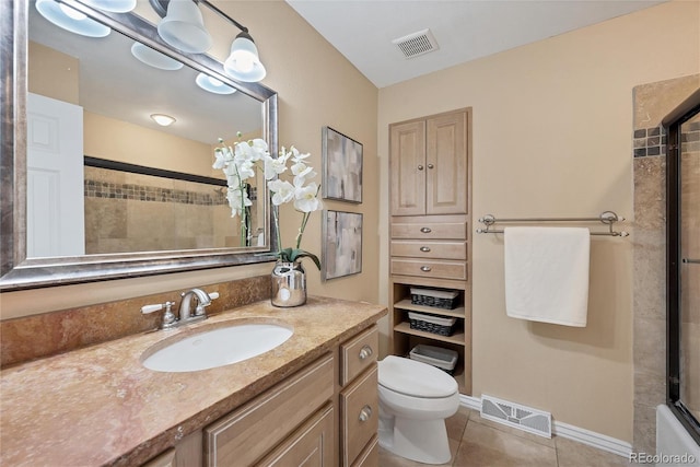 full bathroom featuring vanity, shower / bath combination with glass door, toilet, and tile patterned floors