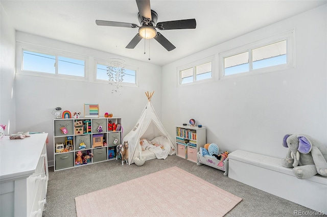 playroom with carpet and a ceiling fan