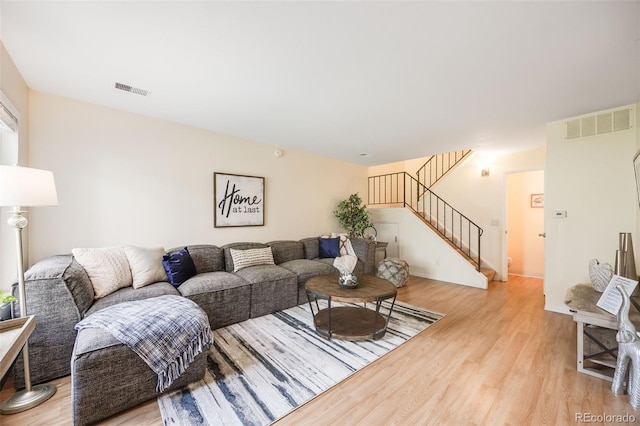 living room with light hardwood / wood-style flooring