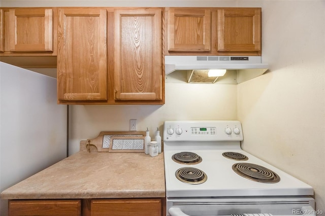 kitchen featuring white range with electric cooktop