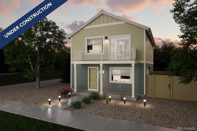 46538 Avery Ln, Bennett, CO 80022 - view of front facade featuring a balcony and board and batten siding