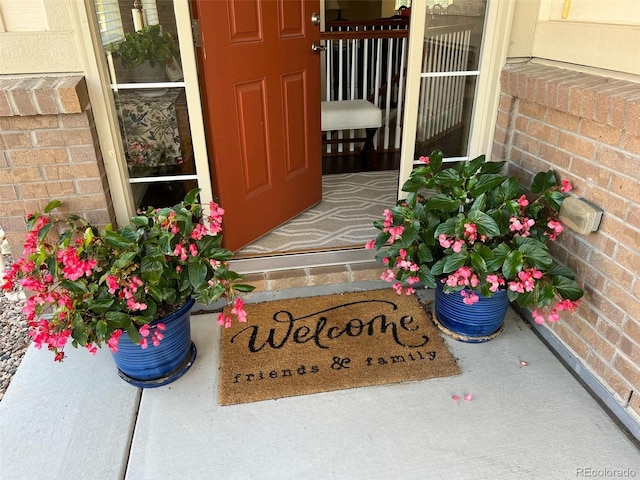 entrance to property with brick siding