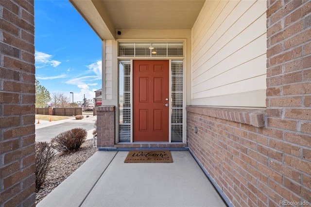 entrance to property with brick siding