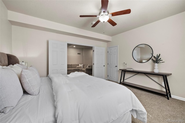 bedroom featuring carpet floors, baseboards, and a ceiling fan