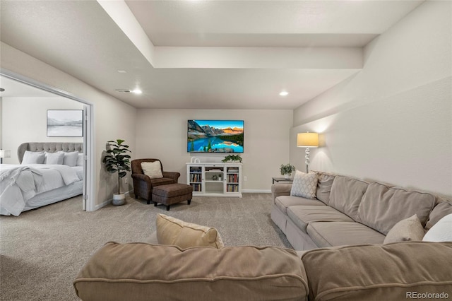 carpeted living area featuring recessed lighting, visible vents, and baseboards