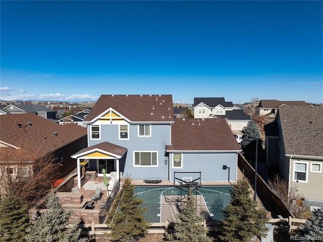 exterior space featuring a residential view, a patio, and fence