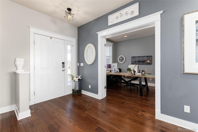 entryway featuring dark wood-style floors and baseboards