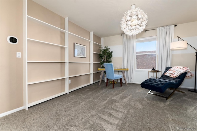 sitting room featuring carpet floors, a chandelier, and baseboards