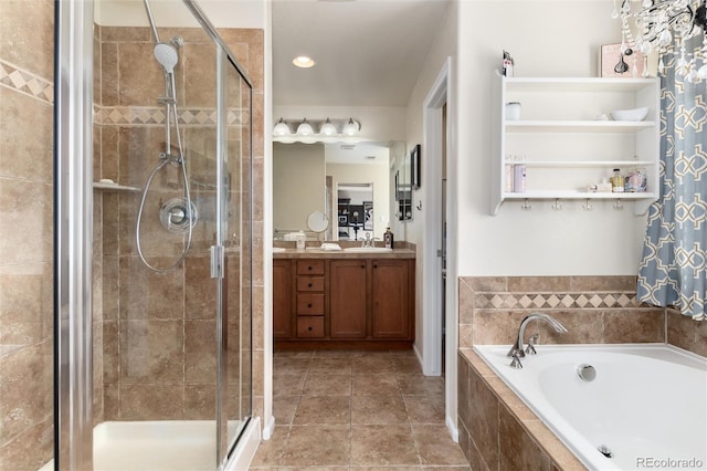 bathroom with tile patterned floors, a shower stall, a bath, and vanity