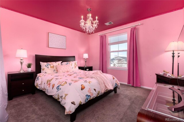 carpeted bedroom with baseboards, visible vents, and a notable chandelier