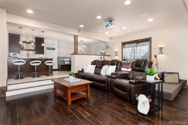 living room featuring wood finished floors, visible vents, and recessed lighting