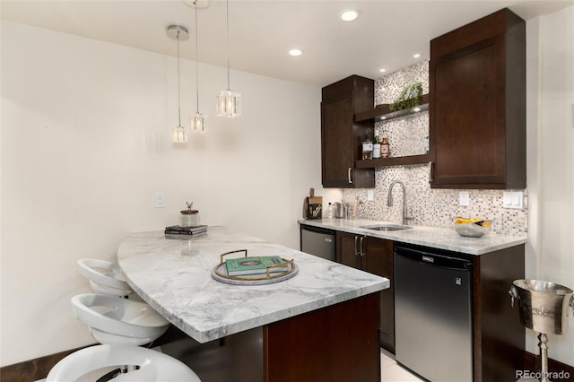 kitchen with open shelves, backsplash, a sink, dark brown cabinets, and dishwashing machine