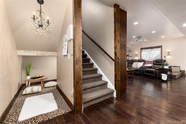 stairs with a chandelier, recessed lighting, baseboards, and hardwood / wood-style flooring