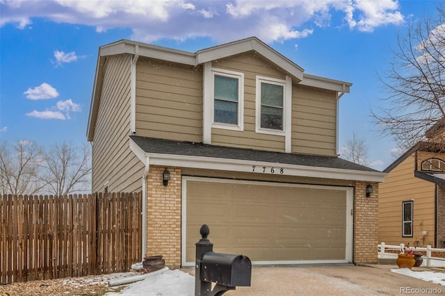 view of property exterior with brick siding, concrete driveway, a garage, and fence