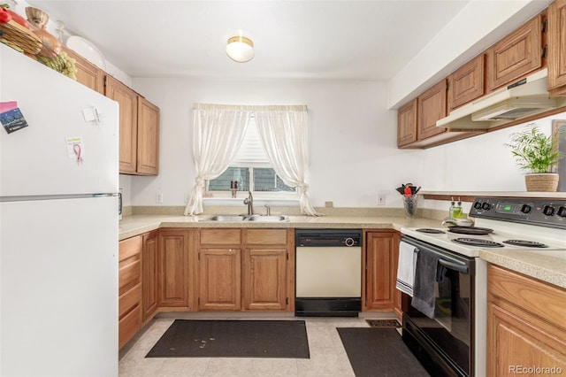 kitchen featuring white appliances, a sink, light countertops, under cabinet range hood, and brown cabinets