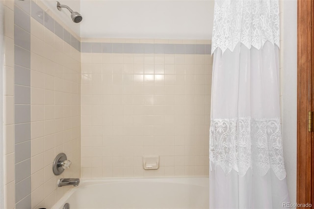 bathroom with shower / bath combination with curtain