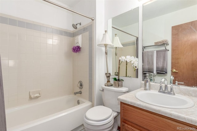 bathroom with vanity, toilet, and washtub / shower combination