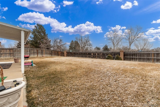 view of yard with a fenced backyard