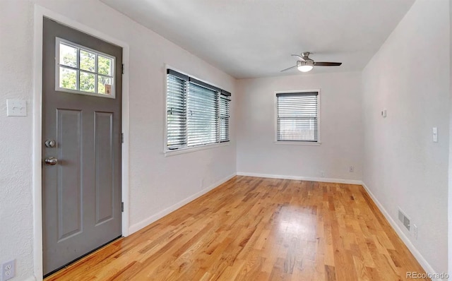 entryway with light hardwood / wood-style floors and ceiling fan