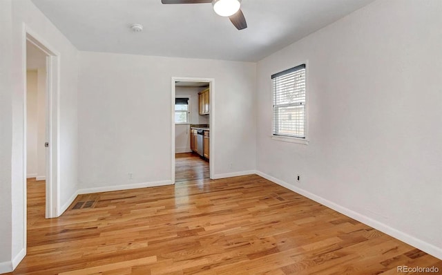 unfurnished room featuring ceiling fan and light hardwood / wood-style floors