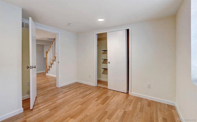 unfurnished bedroom with light hardwood / wood-style floors