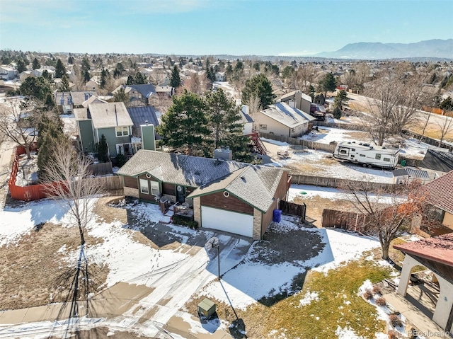 drone / aerial view with a residential view and a mountain view