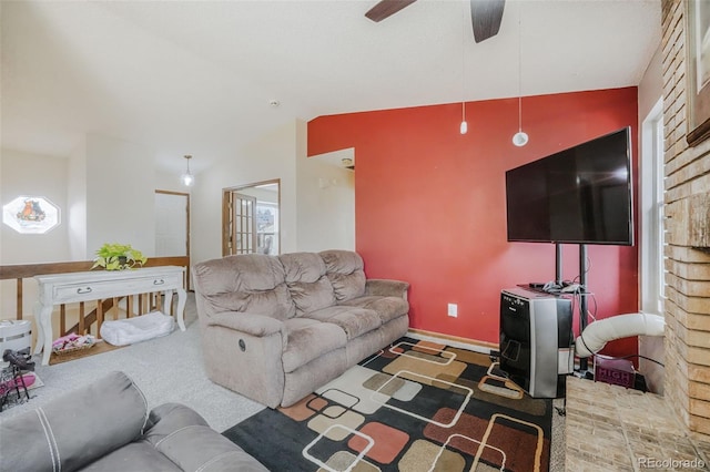 living room with baseboards and a ceiling fan