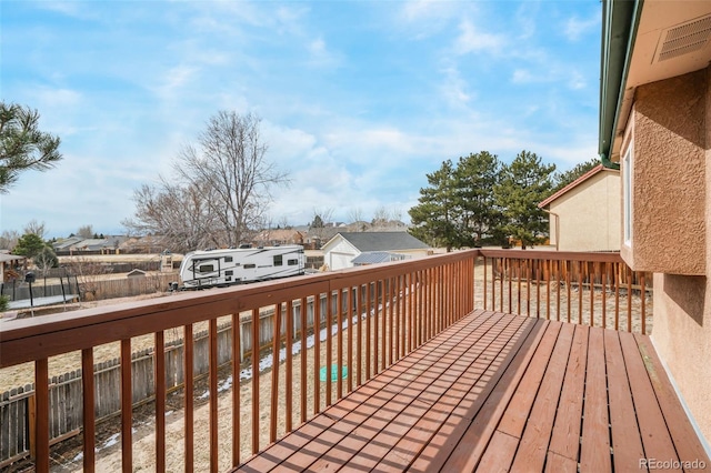 wooden deck featuring a residential view