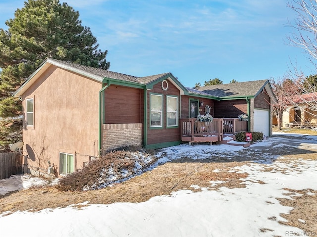 view of front of house featuring stucco siding and an attached garage