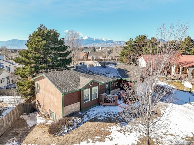 exterior space with a residential view and a mountain view