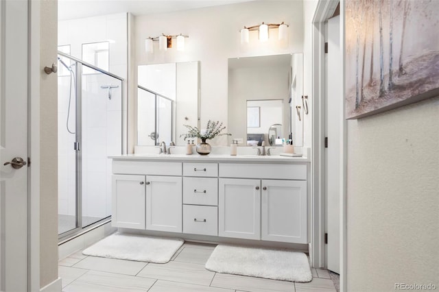 bathroom with vanity and a shower with shower door