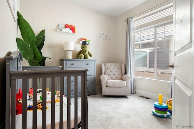 bedroom with carpet floors and a crib